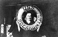 Photo # NH 82952:  Crew member poses with a life ring on USS Pocahontas, circa 1918