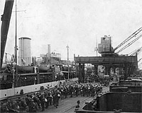 Photo # NH 105492:  USS Lancaster loading homeward bound troops in 1919