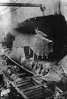 Photo # NH 82758:  Torpedo damage to USS West Bridge