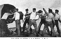 Photo # NH 103303:  Gun crew in action on board USS Finland