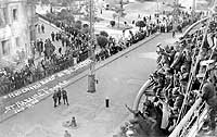 Photo # NH 105071:  Homeward bound troops on USS Sierra wave to onlookers at St. Nazaire, France, 13 July 1919